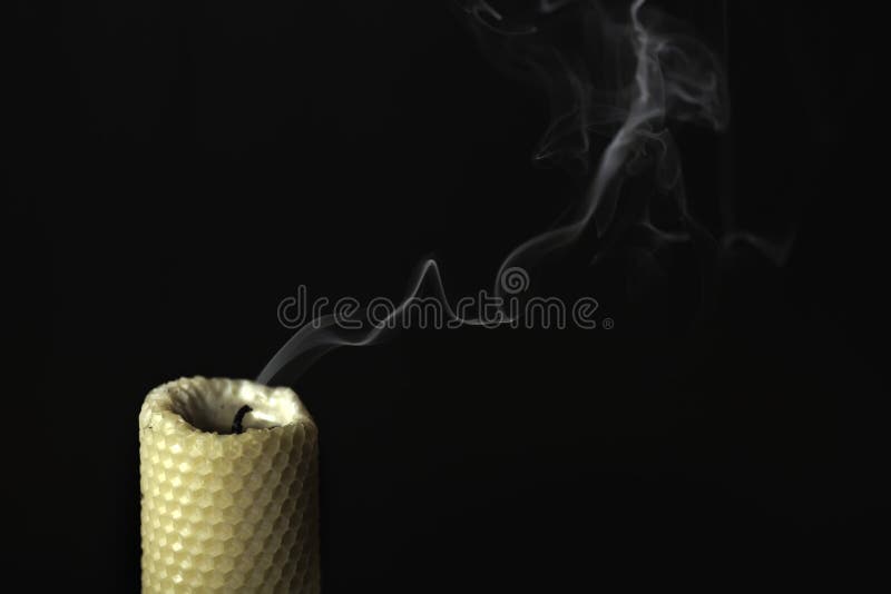 The smoke from the candle