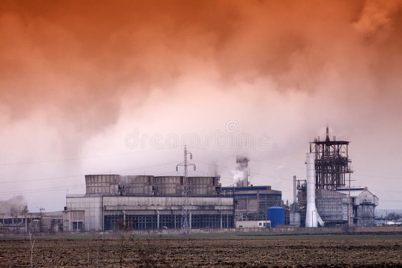 Smoke coming out of old factory chimney