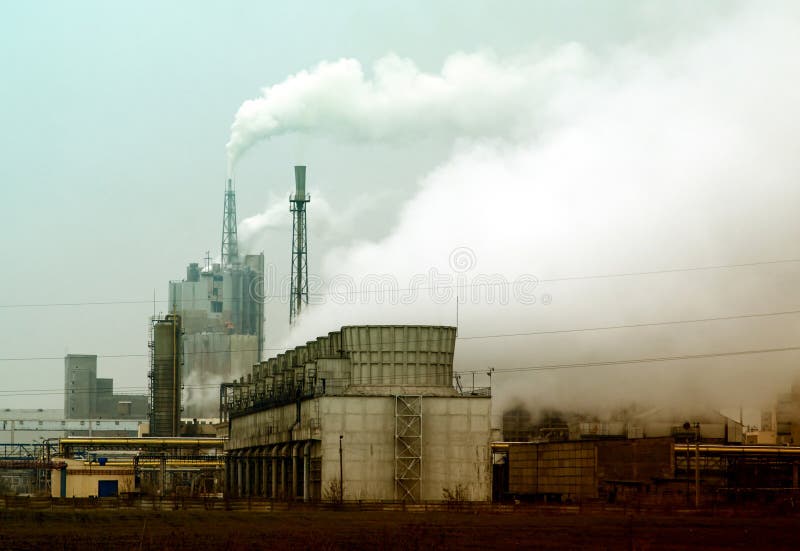 Smoke coming out of old factory chimney