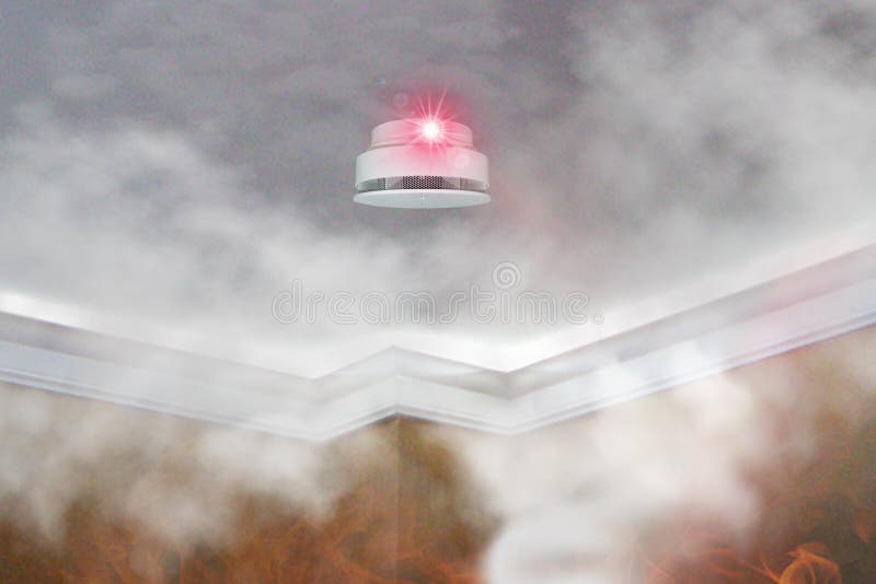 Smoke detector mounted on roof in apartment. fire alert