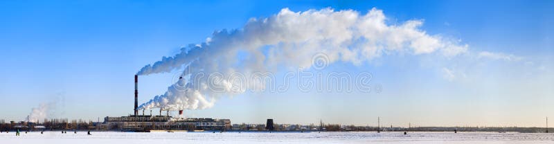 Smoke of pipes in the blue sky.