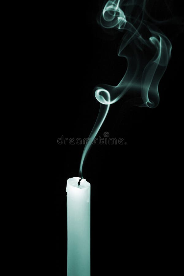 Smoke From An Extinguished Candle Isolated On A Black Background. Can