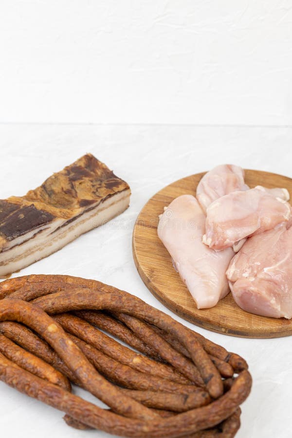 Smoked Bacon Sausages and Chicken Breasts with Copy Space Stock Photo
