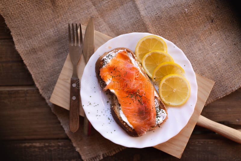 Smoked Salmon with Cheese Toasted Bread Lemon and Yogurt Dip Stock