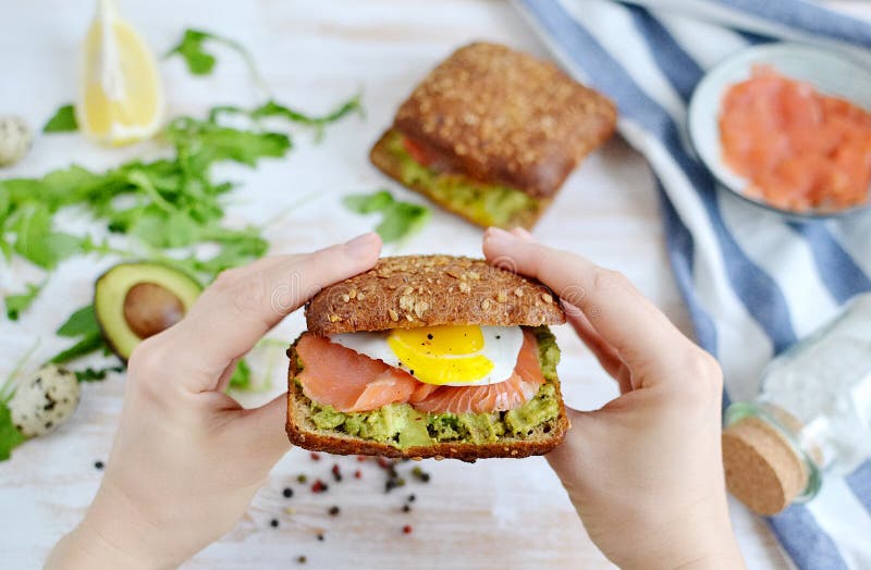 Smoked Salmon Sandwich with Avocado and Quail Egg stock photos Smoked Salmon Sandwich with Avocado and Quail Egg stock photos