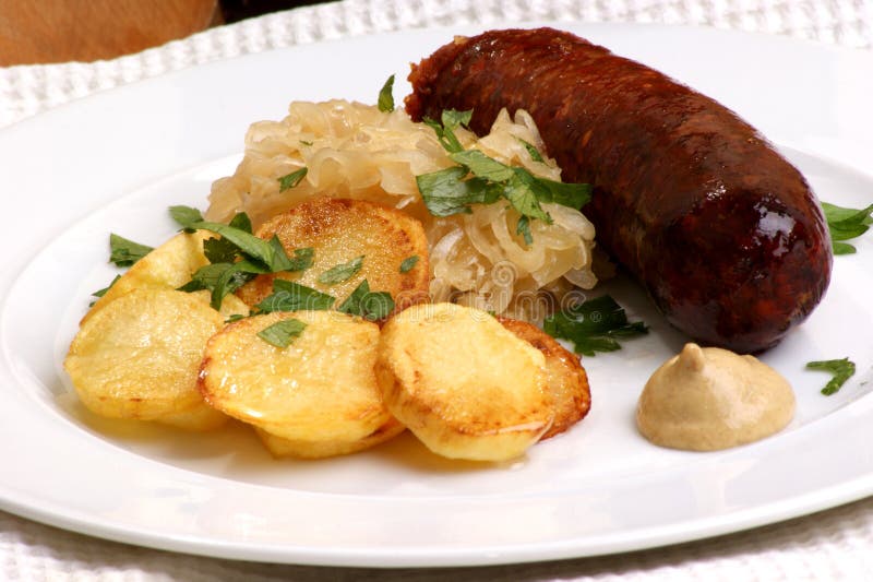 Smoked Sausage with Sauerkraut and Potato Stock Photo - Image of potato ...