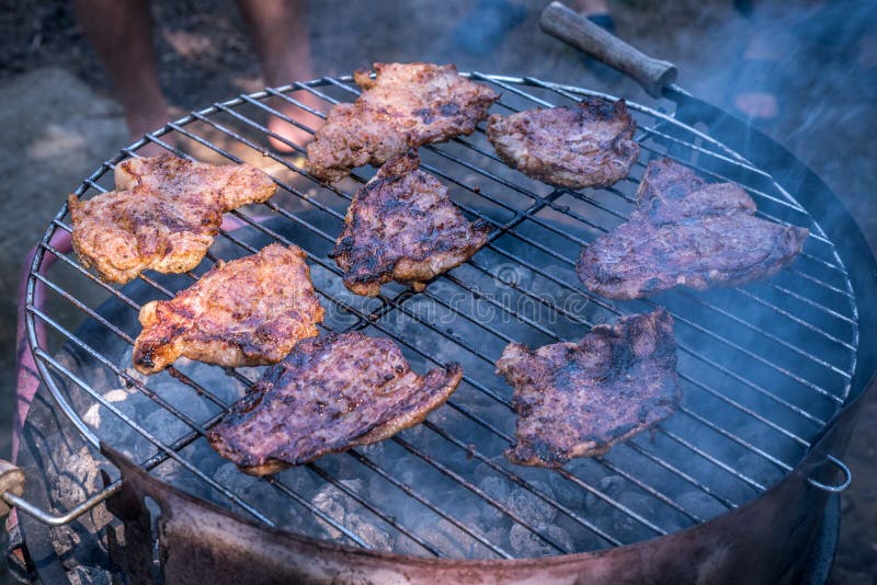 Smoking charcoal barbecue. stock photo. Image of smoke 136912806