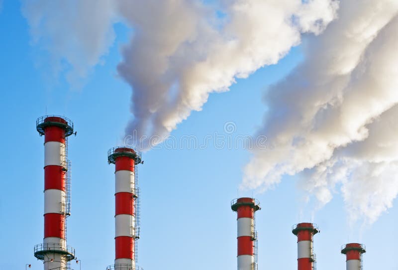 Smoking chimneys polluting the environment stock image