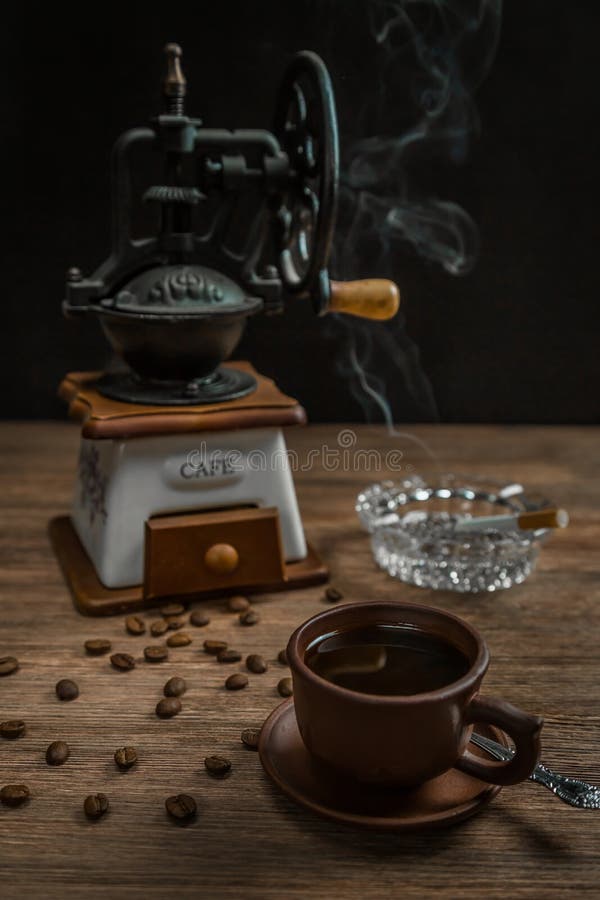 . Smoking cigarette, an ashtray and a Cup of coffee royalty free stock image . Smoking cigarette, an ashtray and a Cup of coffee royalty free stock image