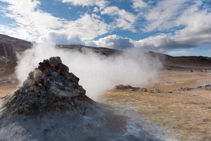 Smoking fumarole near Hverir geothermal area, Myvatn Lake area, Iceland. Geothermal area with smoking fumaroles and mud geothermal royalty free stock images Smoking fumarole near Hverir geothermal area, Myvatn Lake area, Iceland. Geothermal area with smoking fumaroles and mud geothermal royalty free stock images