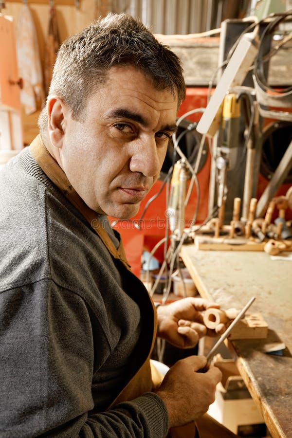Craftsman Sitting In Workshop Stock Image - Image of 