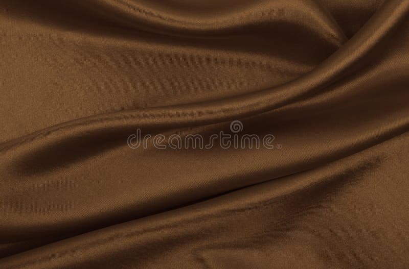 Smooth elegant brown silk or satin texture can use as abstract background. Luxurious background design. In Sepia toned. Retro style