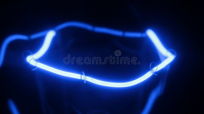 Smooth increase and decrease in power of the blue incandescent lamp. Close-up. Decrease video