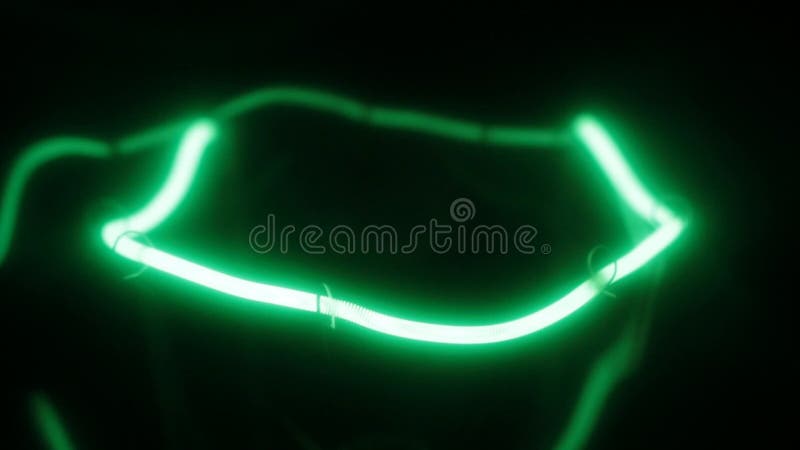Smooth increase and decrease in power of the green incandescent lamp. Close-up. Decrease video