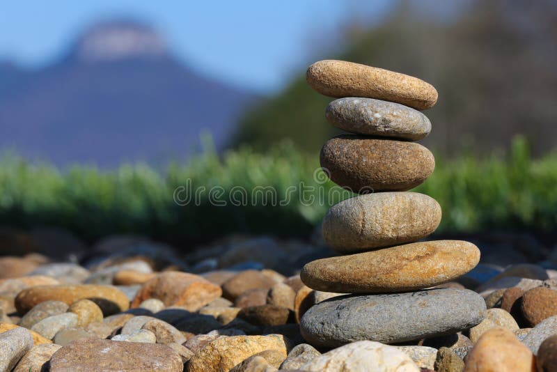 Smooth rocks stacked and balancing