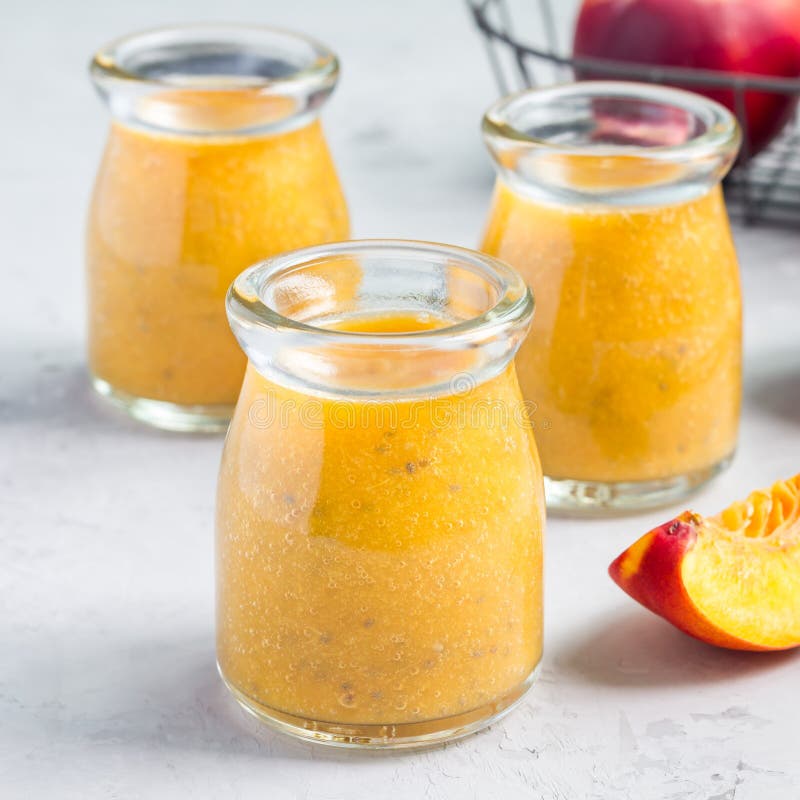 Smoothie with Nectarine, Orange Juice, Chia Seeds and Honey in Glass