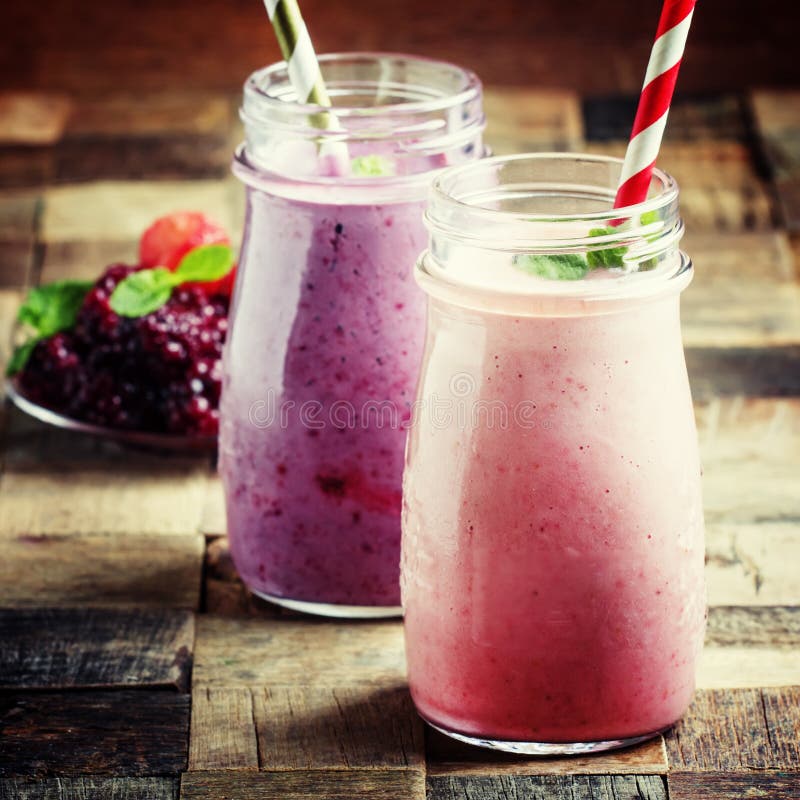 Smoothies from blackberries and strawberries in glass bottle, vi royalty free stock image Smoothies from blackberries and strawberries in glass bottle, vi royalty free stock image