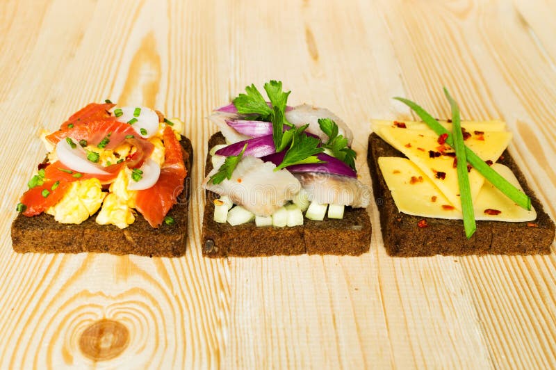 Smorrebrod Danish Open Sandwich with Fish, Herring, Cheese Stock