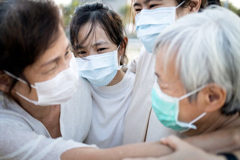 Sad asian family wearing medical mask crying,suffer from grief,great loss of her family infected,fight the Covid-19,Coronavirus outbreak,people affected epidemic crisis ,hug,comforting,encouragement. Sad asian family wearing medical mask crying,suffer from grief,great loss of her family infected,fight the Covid-19,Coronavirus outbreak,people affected epidemic crisis ,hug,comforting,encouragement