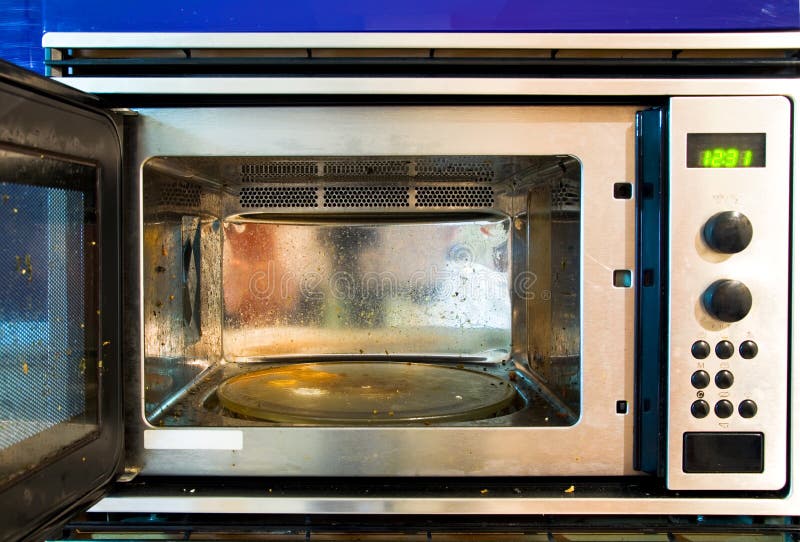 Close up of a functional but dirty microwave oven,. Close up of a functional but dirty microwave oven,