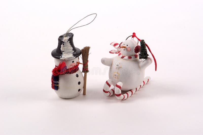 2 Christmas Tree Ornaments. Both snowmen, one on candy cane skis an done holding a broom. 2 Christmas Tree Ornaments. Both snowmen, one on candy cane skis an done holding a broom
