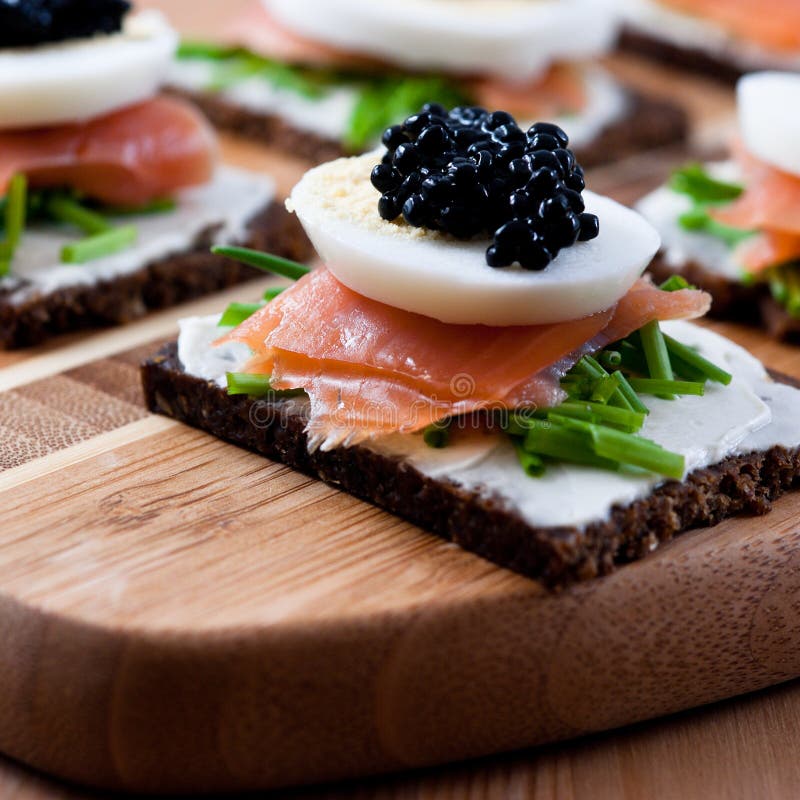 Snack with caviar and salmon