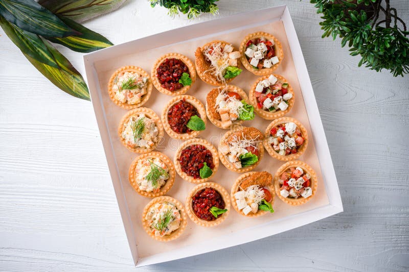 Snack Food Delivery for Catering. Box with Canape Snacks Shot Fresh