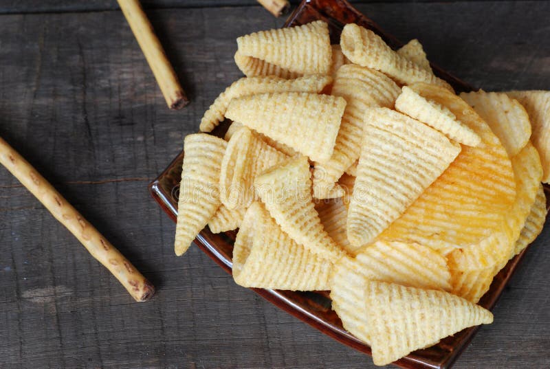 Snack Potato Crisp Corn Chips. on the Old Wooden Floor Stock Image