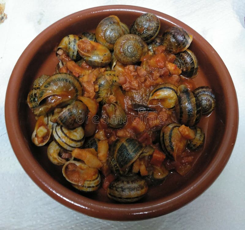 Spanish Caracoles En Salsa, Cooked Snails In Sauce Stock Photo Image