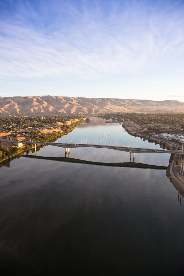 An early morning areal view from a hot air balloon of the Southway Bridge over the Snake River with Clarkston Washington on the left, and Lewiston Idaho on the right.