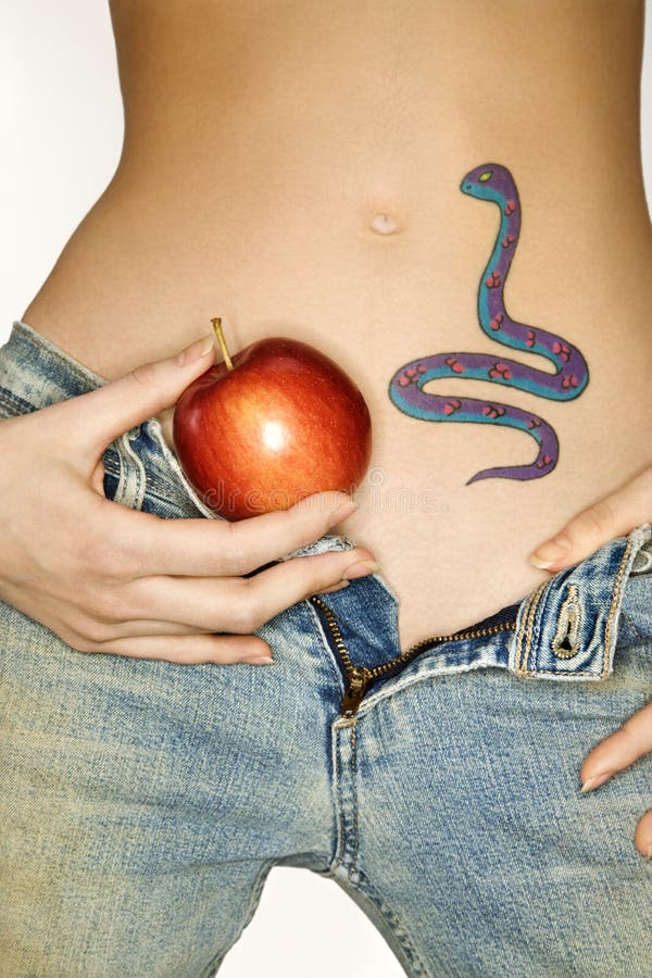 Snake tattoo and apple. stock photo. Image of forbidden