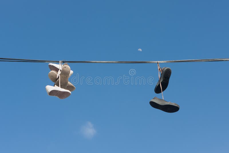 Sneakers Hanging on Electric Wires Stock Photo - Image of canvas, pair:  232207934