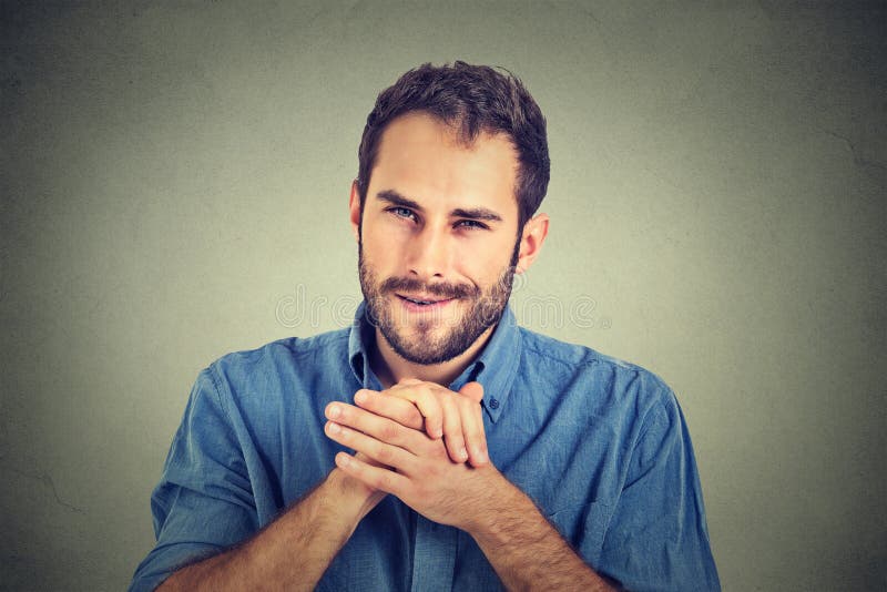 Free Photo  Handsome young male pretending to show something in