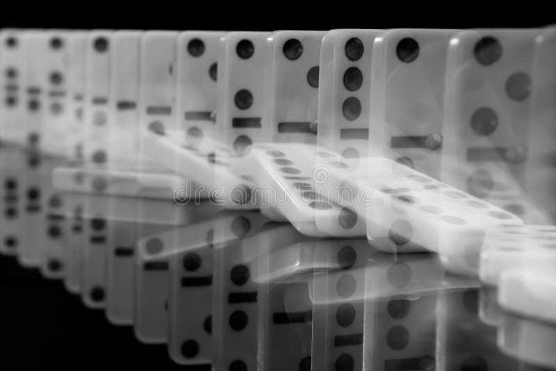 Domino falling effect on black background. Domino falling effect on black background