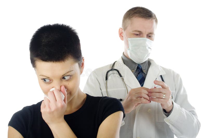Sneezing girl and doctor stock photo