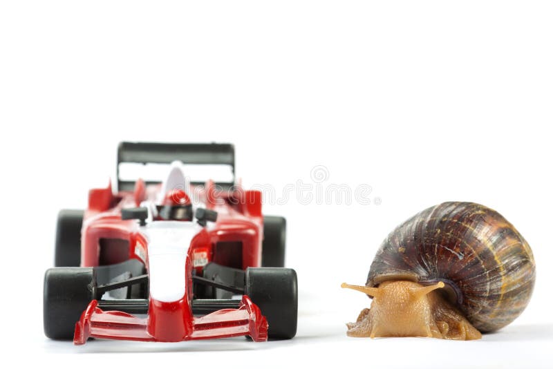 A Snail and an F1 toy car ready to race. A Snail and an F1 toy car ready to race