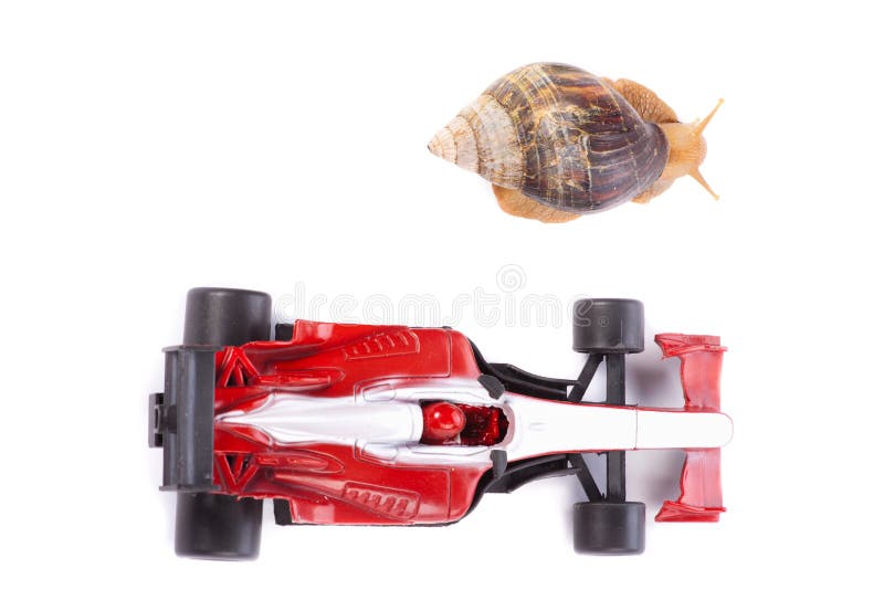 A Snail and an F1 toy car ready to race seen from above. A Snail and an F1 toy car ready to race seen from above