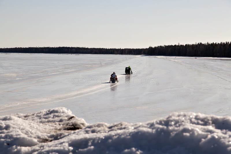 Snomobiling on an ice road