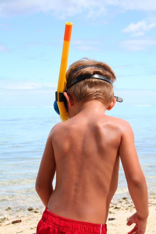 Snorkeling boy on the beach