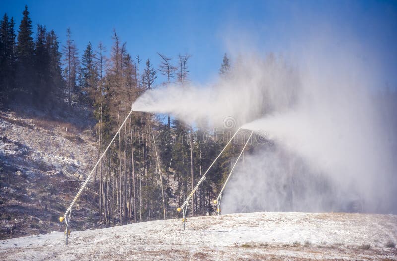 Snow Cannon in Winter Mountains. Snowgun Spraying Artificial Ice
