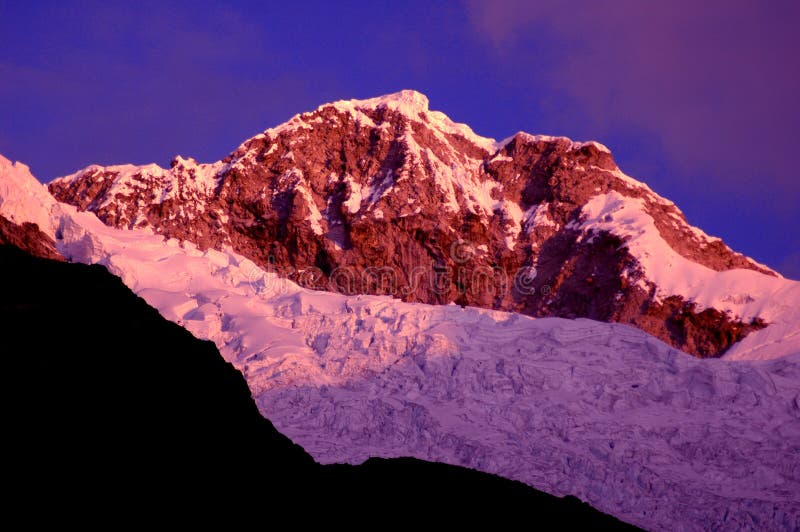 Snow-capped mountains at dusk royalty free stock photos