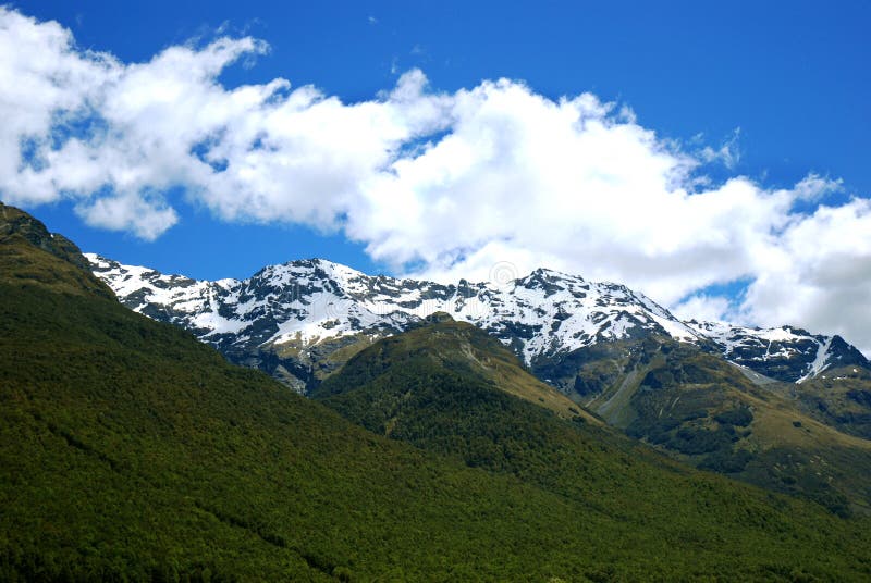 Snow capped mountains in NZ stock images