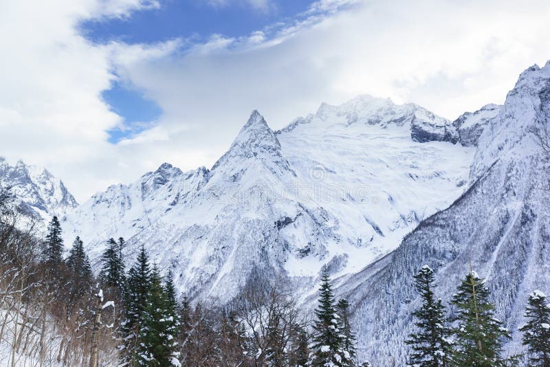 Snow-capped Peaks of the Caucasus Mountains Envelop the White Clouds ...