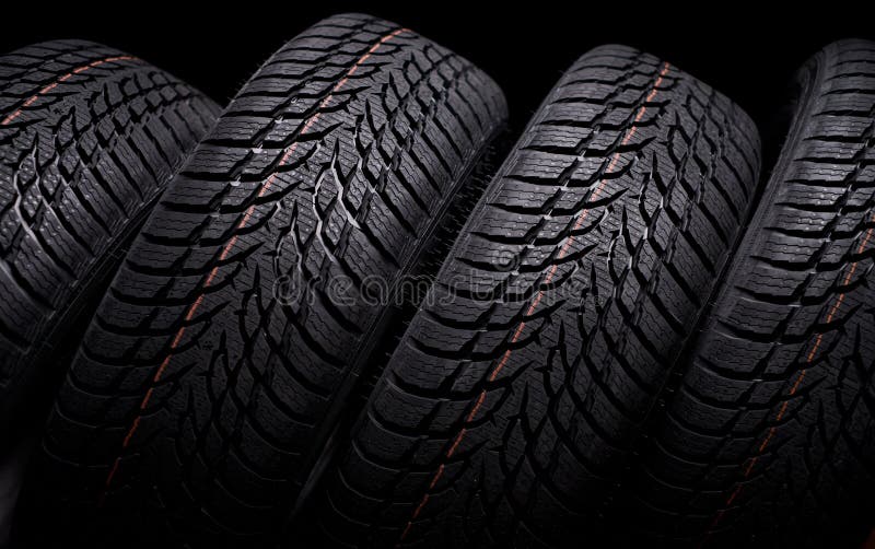 Snow car tires on black background