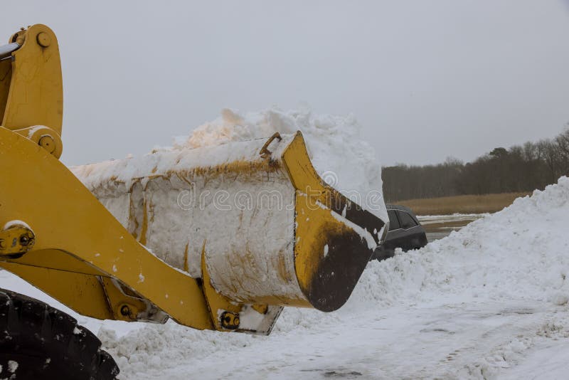 Snow Clearing Tractor Clears The Way After Heavy Snowfall Stock Photo Snow Clearing Tractor Clears The Way After Heavy Snowfall Stock Photo