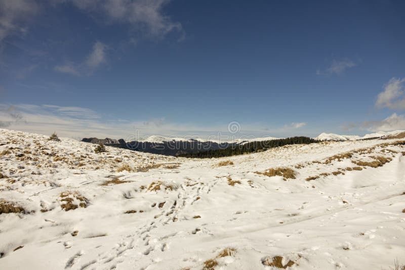 Snow And Clouds In Winter Mountains