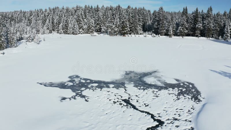 Snow covered frozen lake in winter