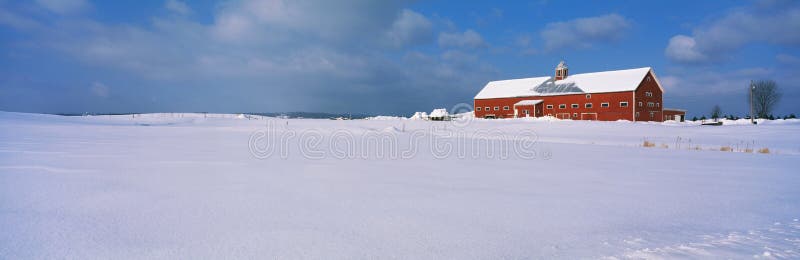 Snow covered red barn in New England