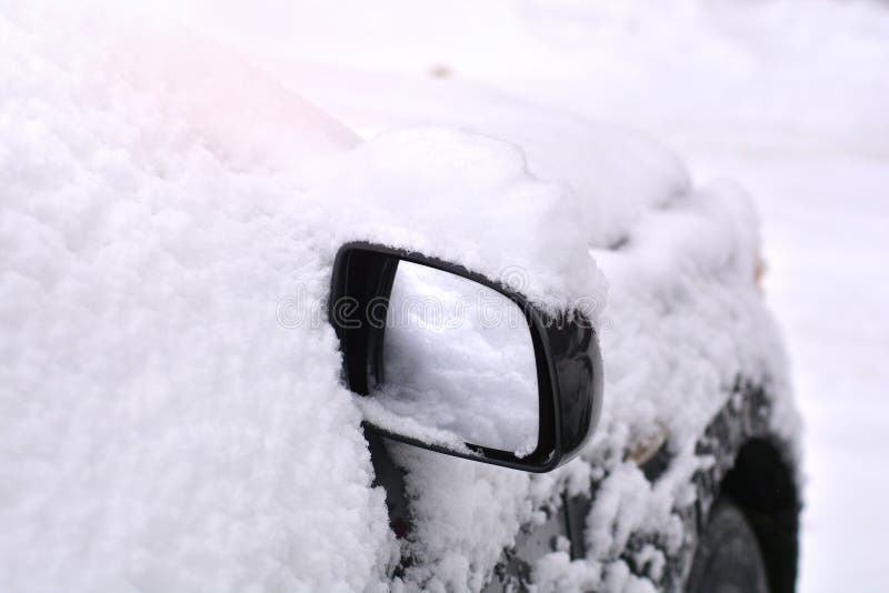 Snow cowered car on a parking lot. stock images Snow cowered car on a parking lot. stock images