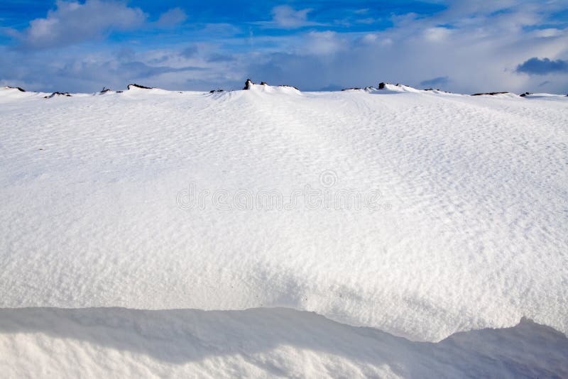 Snow dune in a ditch stock images
